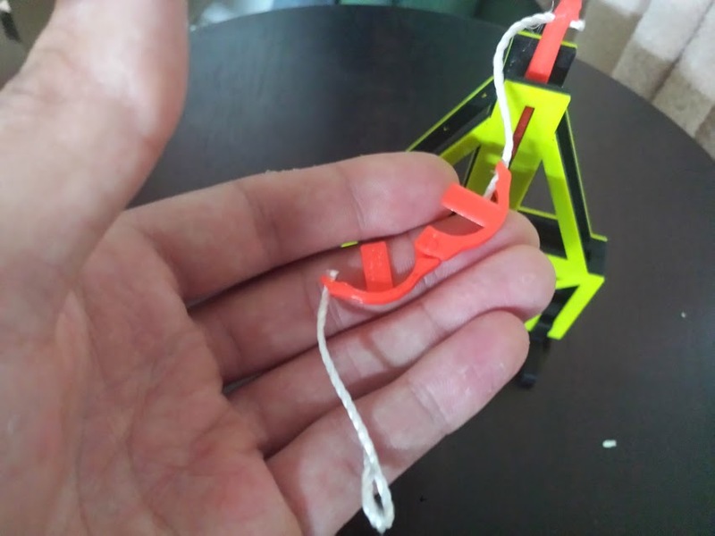 Floating arm trebuchet (dimes and pennies)