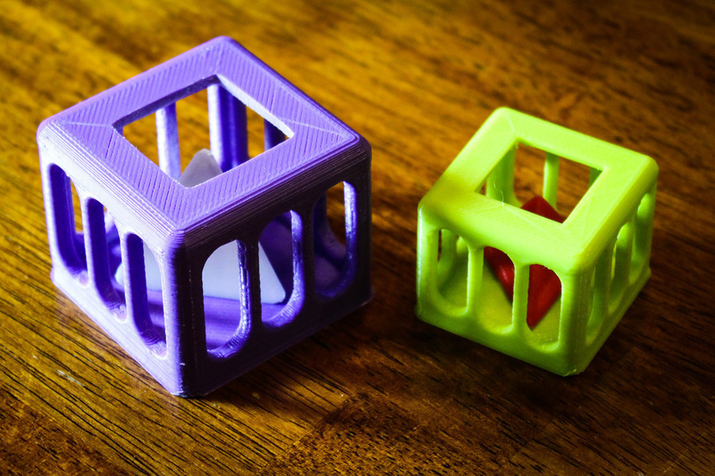 Caged Tetrahedron Puzzle