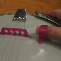 Small 5 string banjo bridge and thumb pick 3D Printing 90884