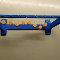 Pendulum Wave: Relating Wavelength to Frequency - Thumbnail 6
