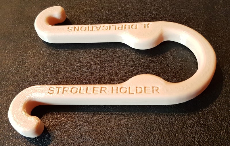 THE STROLLER HOLDER