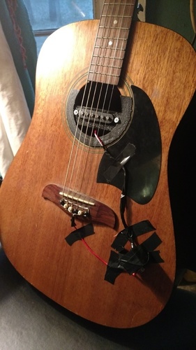 Acoustic guitar pickup cradle