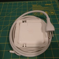 Small Macbook Pro USB-C Charger Wrap with Cord Cutout 3D Printing 138519