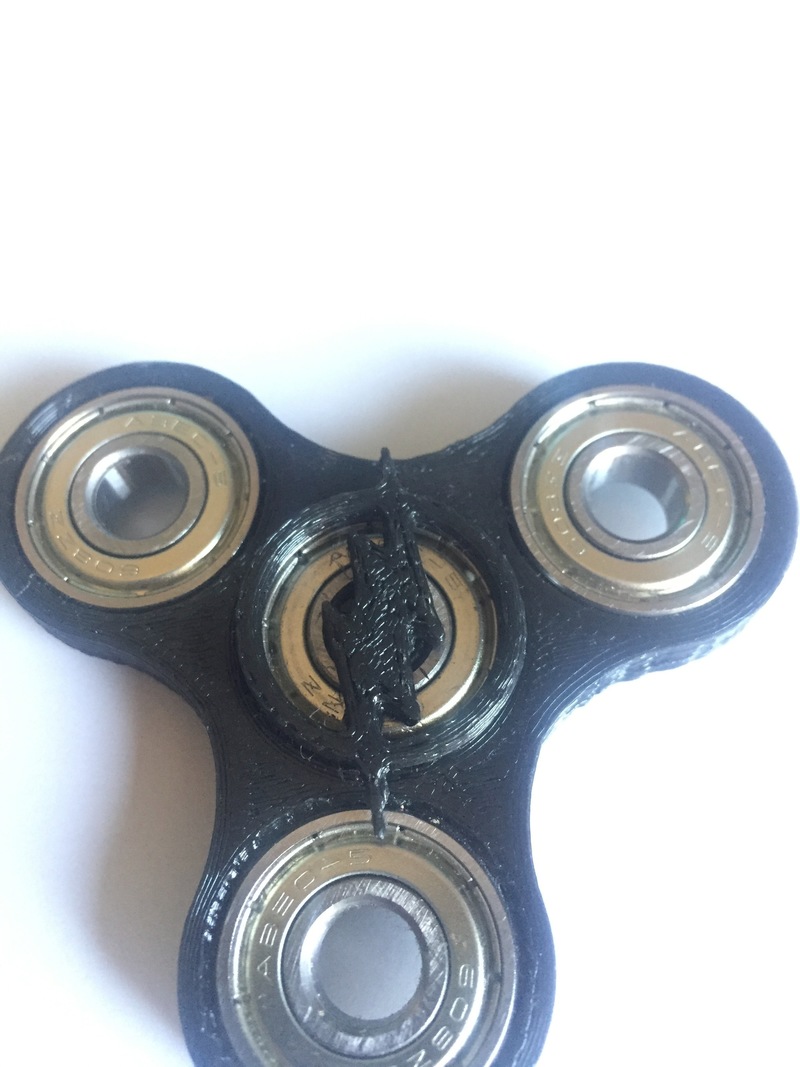 Spinner with flash emblem