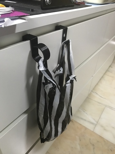 Drawer plastic bag hanger