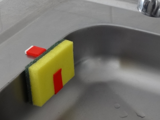 A sponge holder I designed and printed for my kitchen sink. I was tired of  leaving my sponge in the sink or on the edges, so this was my solution. :  r/3Dprinting