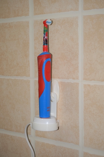 Electric toothbrush charger wall hanger