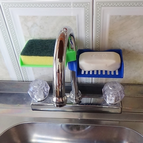 A sponge holder I designed and printed for my kitchen sink. I was tired of  leaving my sponge in the sink or on the edges, so this was my solution. :  r/3Dprinting