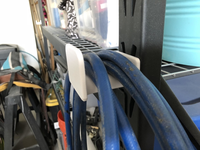 Shelf hose hanger