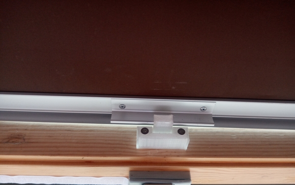 Holder for darkening roller blind