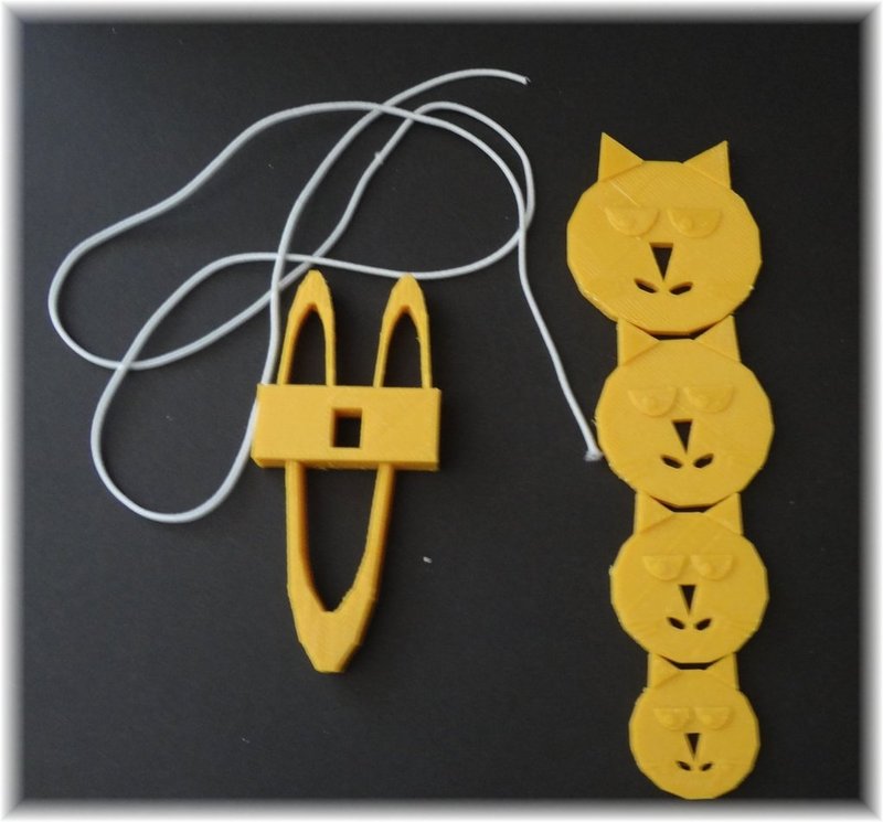 Knitting fork, own fantasy design combined with a cat button