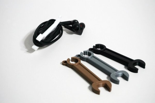 Wrench shaped earphone holder