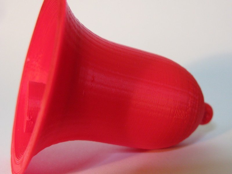 Bell with integral clapper