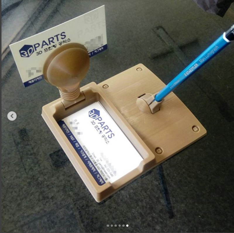 Light bulb concept business card holder