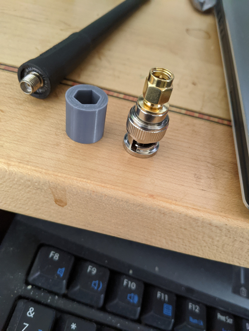Strain relief spacer for SMA antenna to BNC adapter