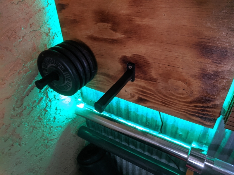 Standard weight plate wall mounted storage pin