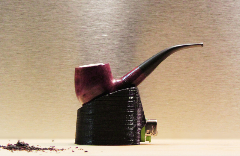 Stand for a pipe with a lighter