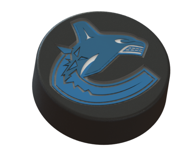 Vancouver Canucks logo on ice hockey puck