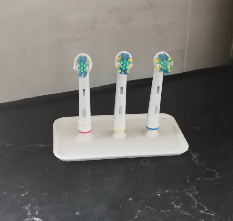 Tooth brush head holder