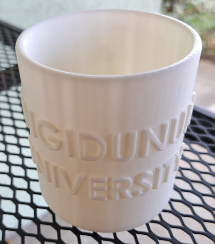 Round pencil case with the inscription SINGIDUNUM UNIVERSITY 3D Print 539570