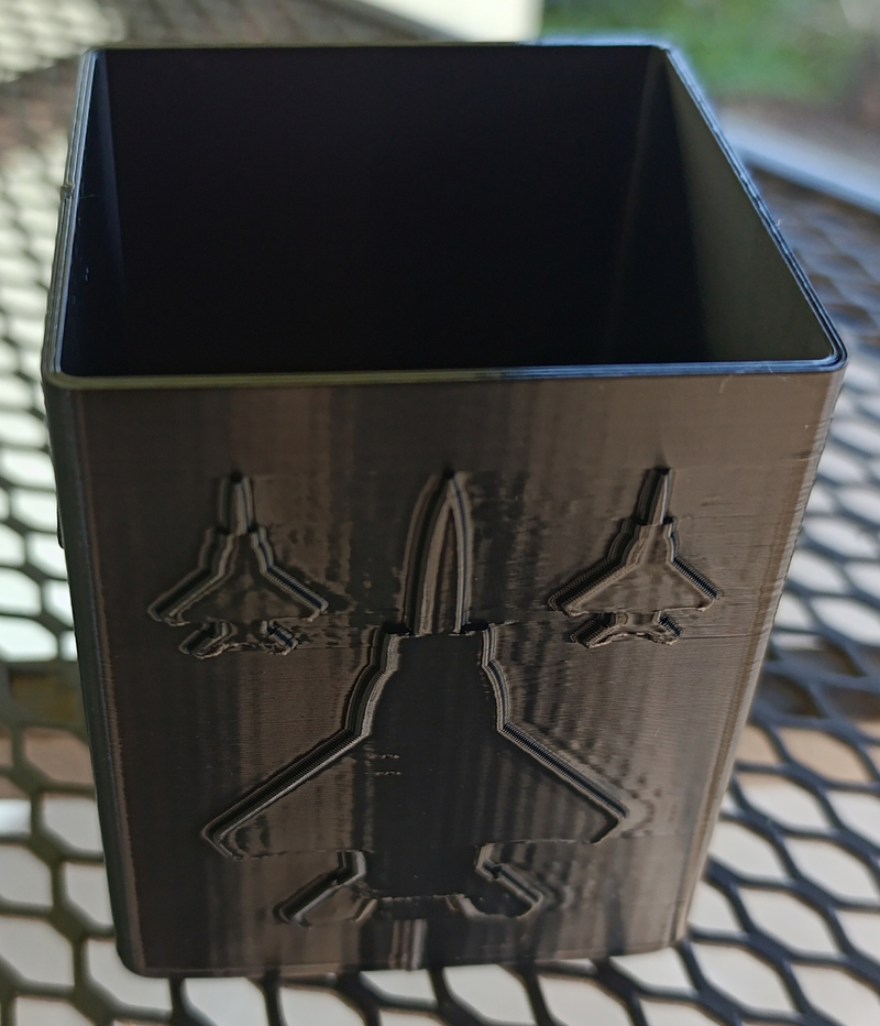 Square pencil case with silhouettes of American fighter planes