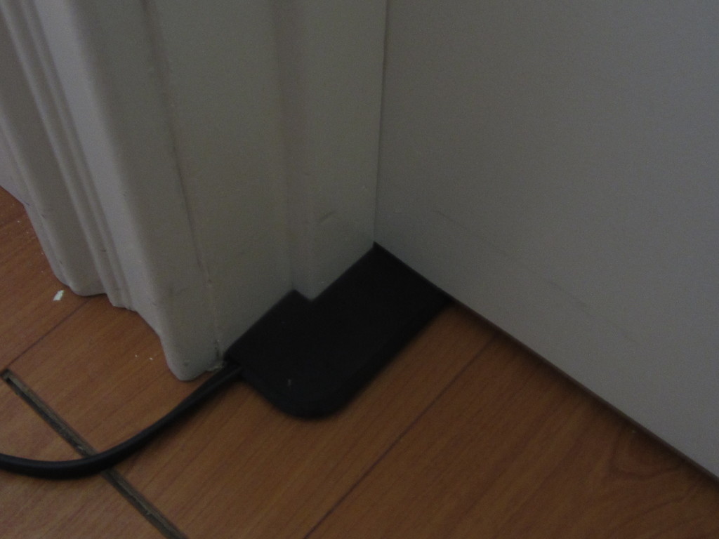 Extension cord under door Extension cord under door