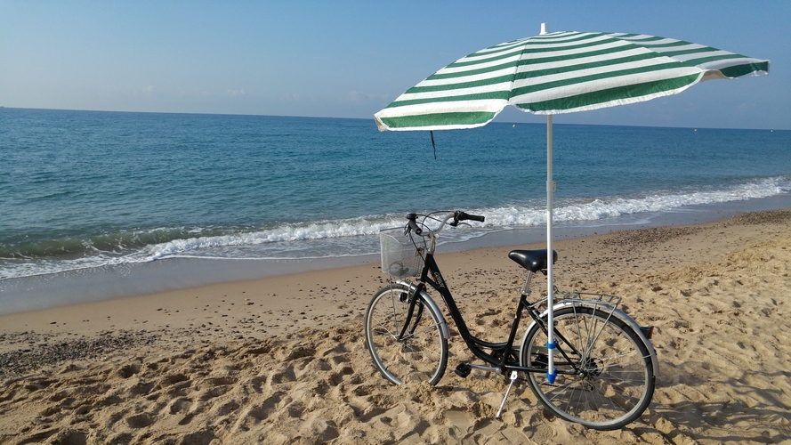 Bike accessory for a beach umbrella